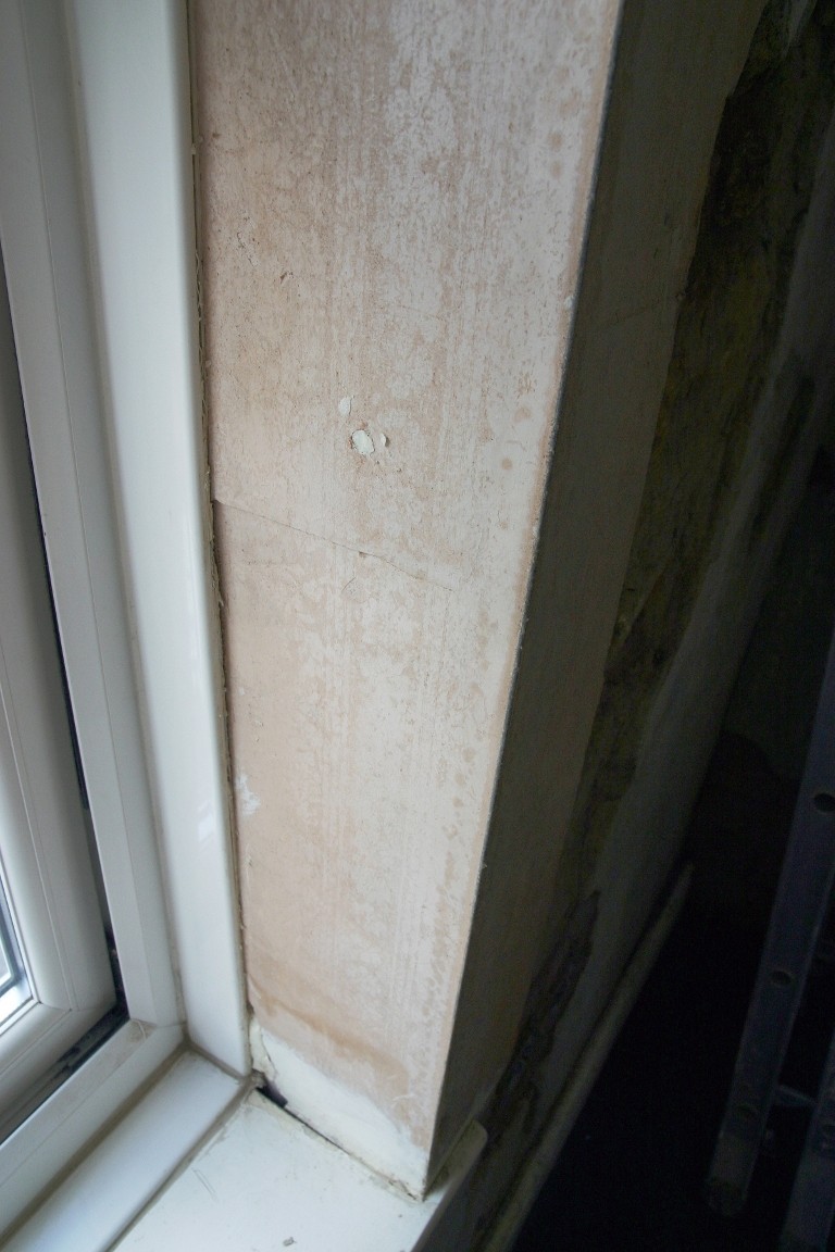 Unstable Window Surround Fixed With Small Hole And A Tin Of Expanding Foam